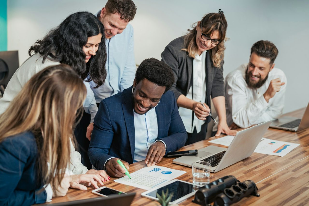 Business team of diverse people doing strategic planning work inside modern office.jpg