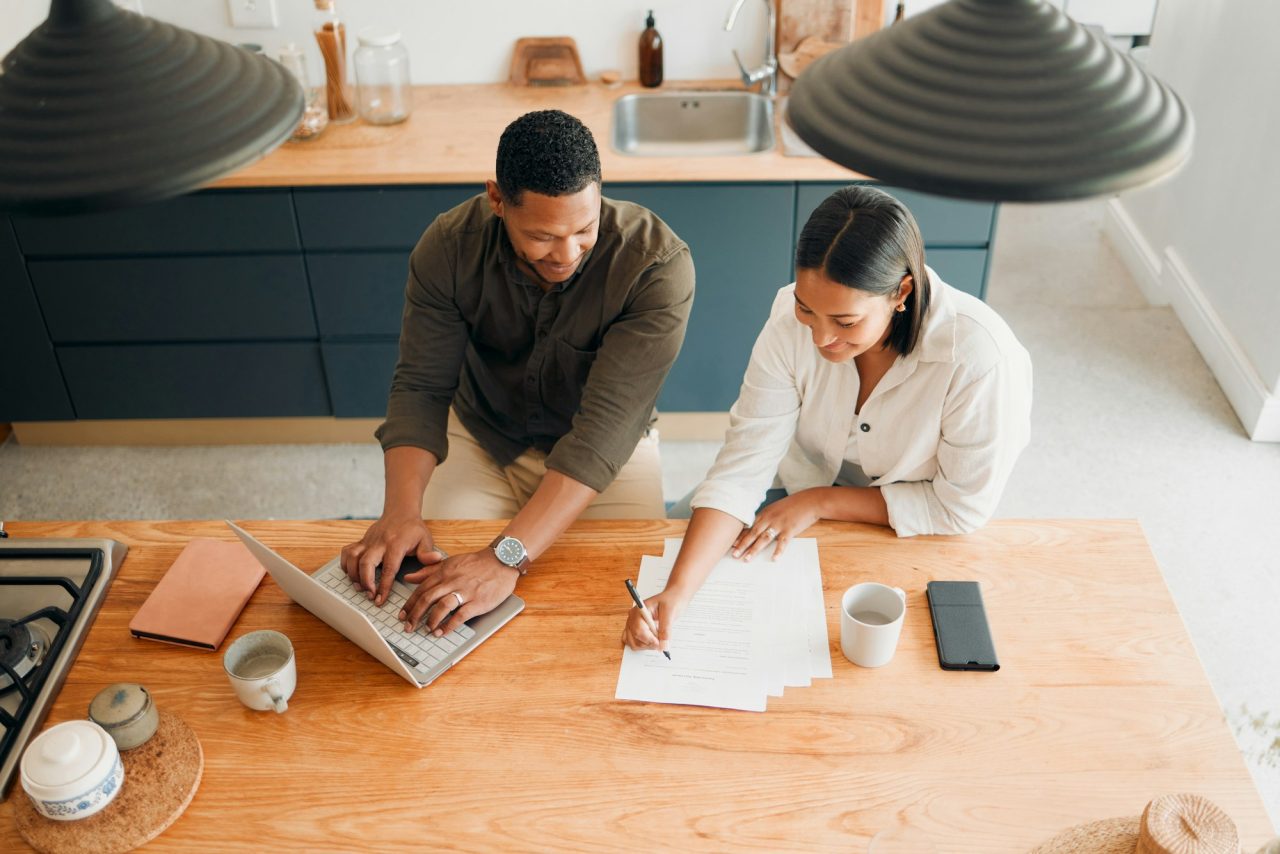 Couple calculating budget finance and tax while planning investment loan and bills at home from a.jpg